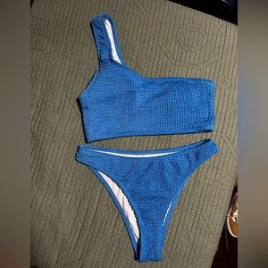 Size small women’s blue ribbed one shoulder bikini with high leg bottoms